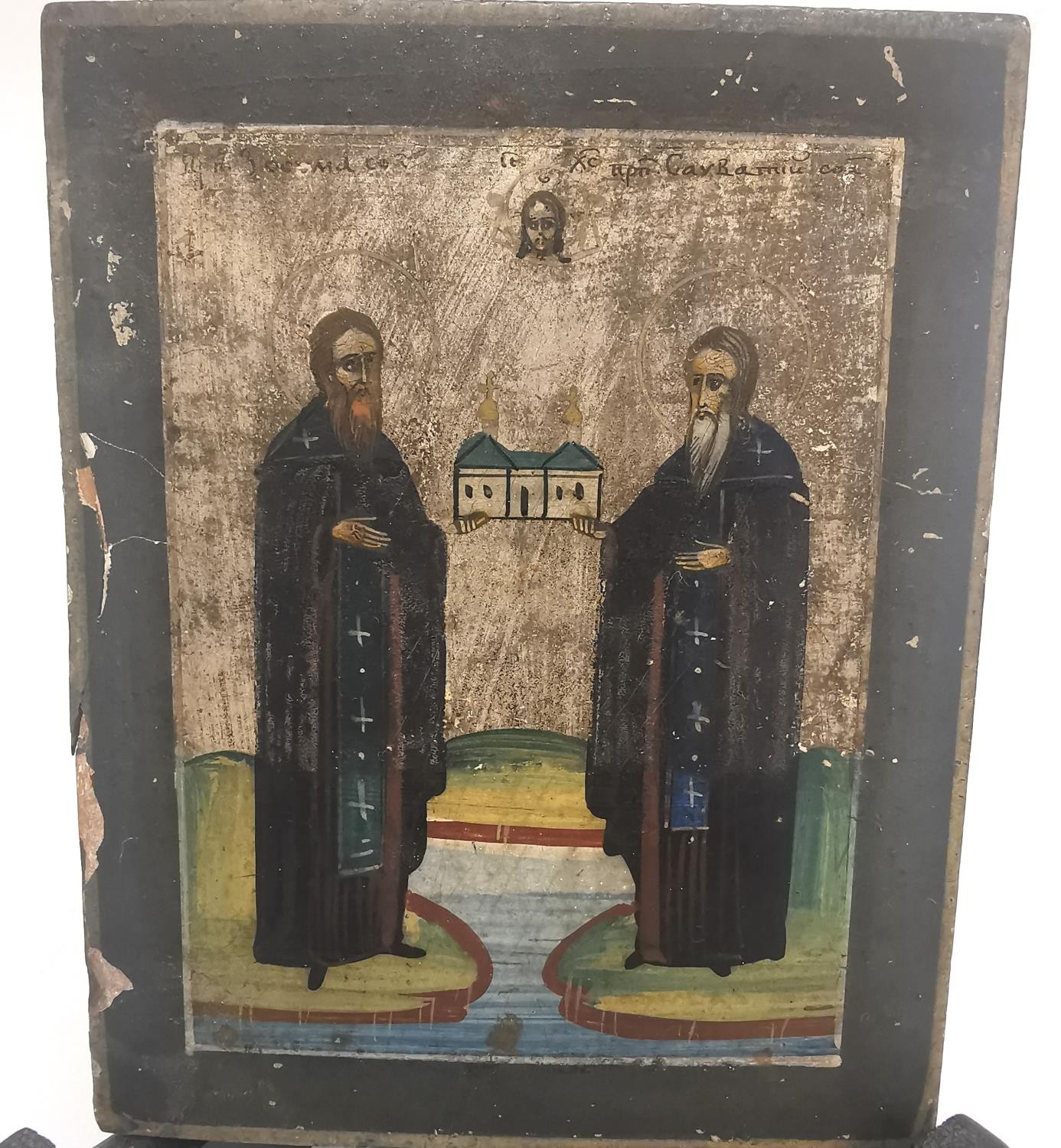A 19th/early 20th century Orthodox painted religious icon on wood. Featuring two saints holding - Image 2 of 8