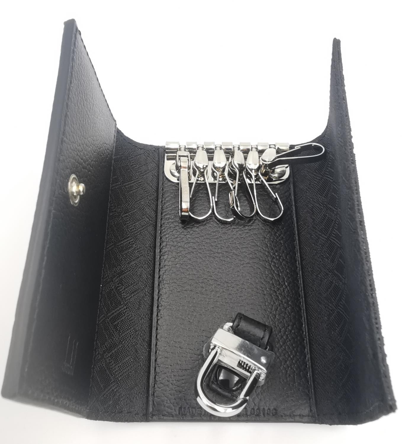 A boxed Dunhill key case and key holder black PVC and leather with impressed monogram design. (holds - Image 2 of 6