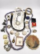 A collection of jewellery, including a string of 19th century venetian chevron drawn cane glass