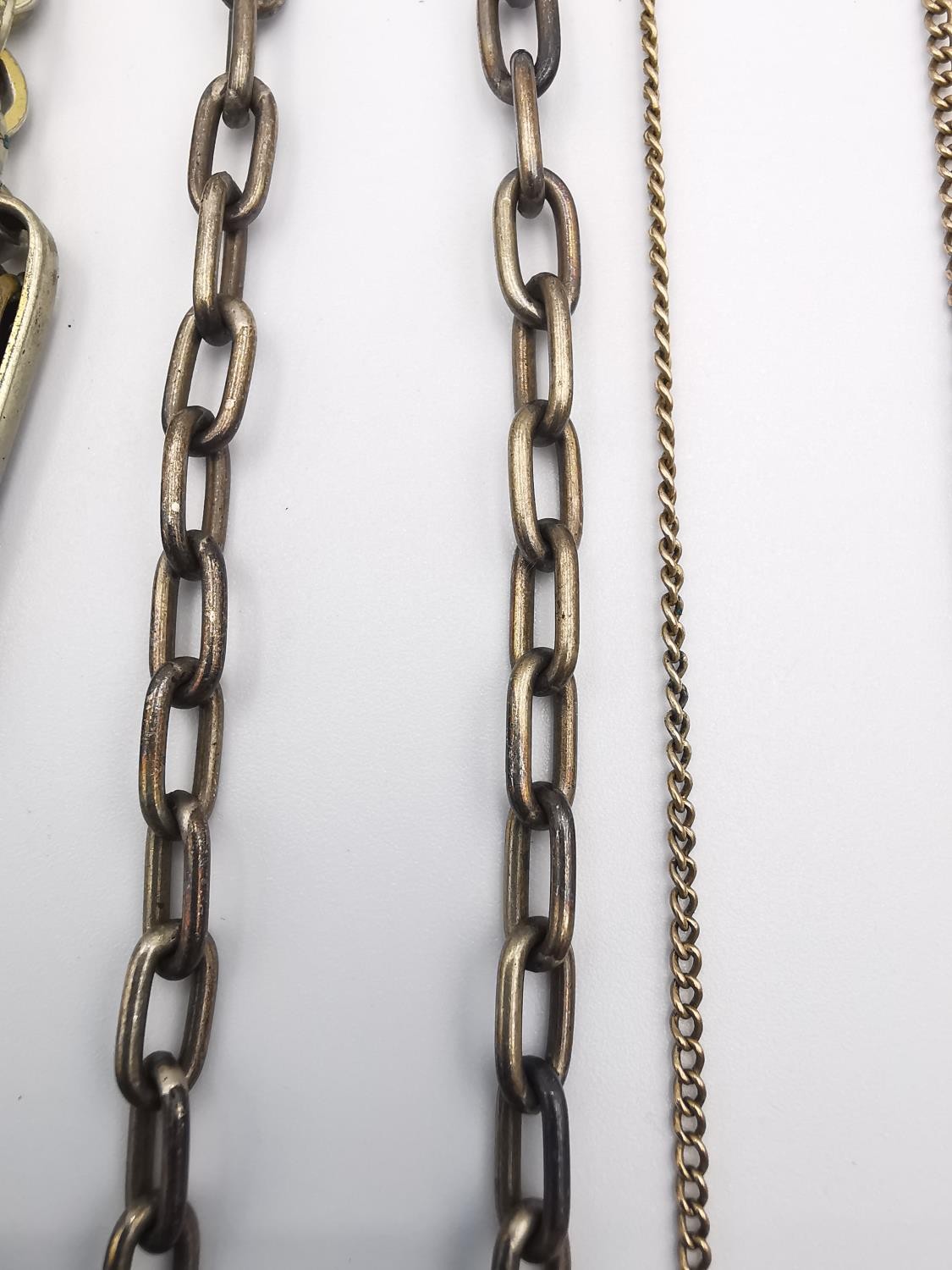 A collection of Victorian watch chains, including a 9ct rose gold and copper link pocket watch chain - Image 6 of 11