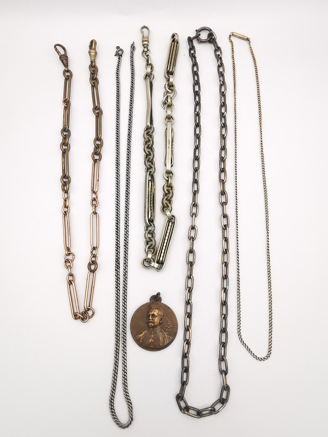 A collection of Victorian watch chains, including a 9ct rose gold and copper link pocket watch chain