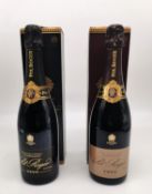 Two boxed Pol Roger Champagne bottles. One bottle Pol Roger vintage Brut Extra Cuvée de Reserve,