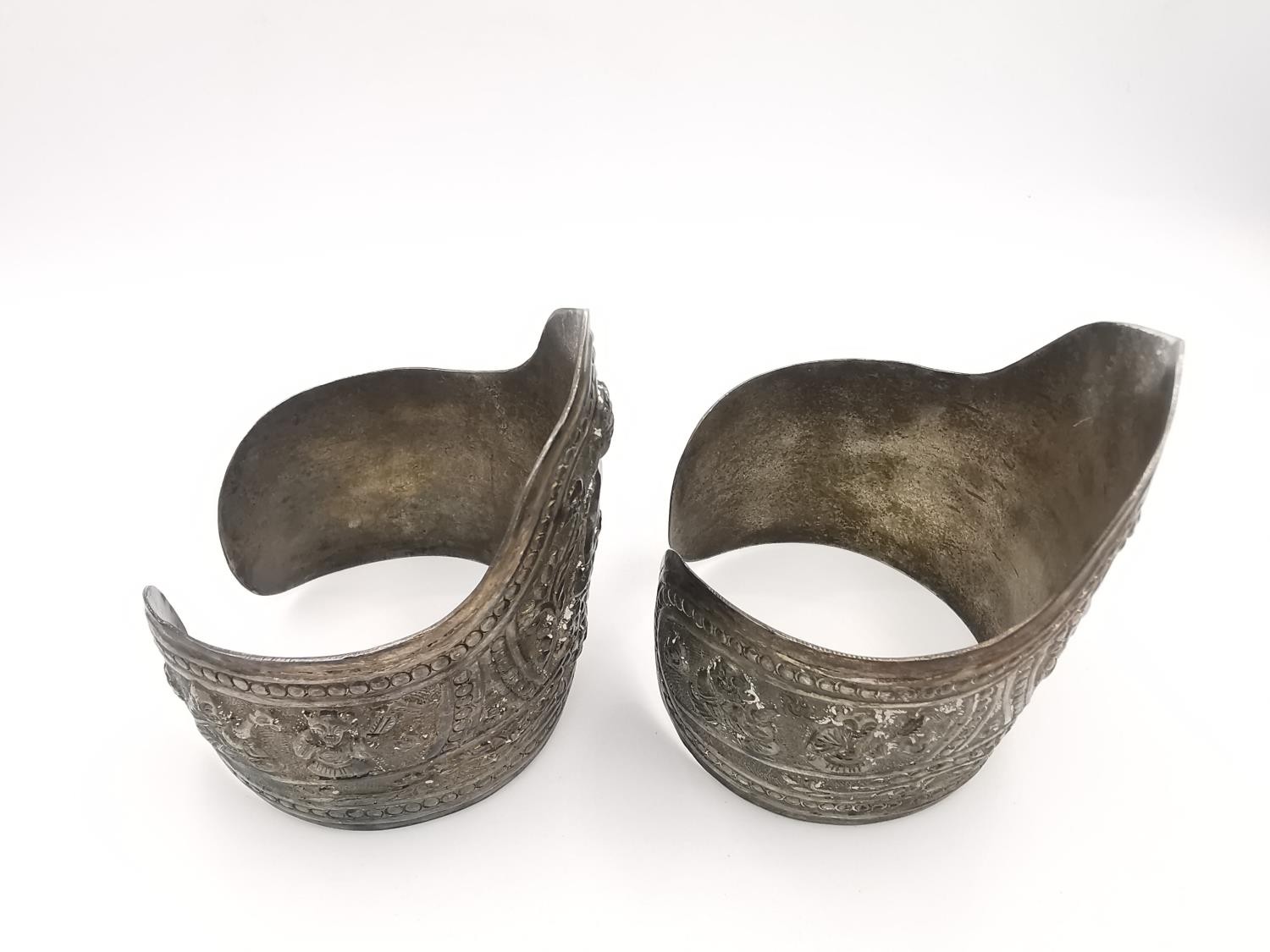 A pair of early 20th century repousse Chinese silver cuffs decorated with buddha and lotus motifs - Image 2 of 7