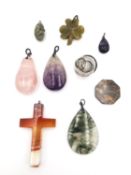 A collection of gemstone and mineral pendants, including a silver and Blue John and silver drop