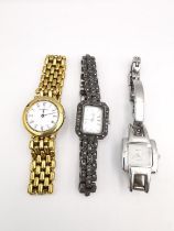 Three ladies Quartz fashion watches, including a silver and marcasite ladies fashion watch with