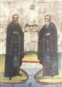 A 19th/early 20th century Orthodox painted religious icon on wood. Featuring two saints holding
