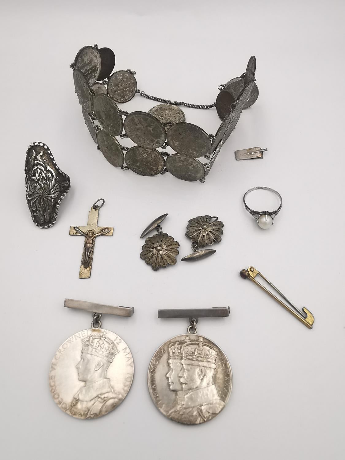 A collection of silver medals and jewellery, including two white metal commemorative coronation