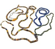 A collection of six African venetian glass trade bead necklaces and two bracelets. The long