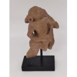 A Kushan carved red sandstone figure of a lady dancing. Possibly from an altarpiece or doorway,