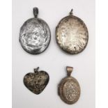 A collection of a three silver lockets and a Swiss engraved silver heart pendant. One locket