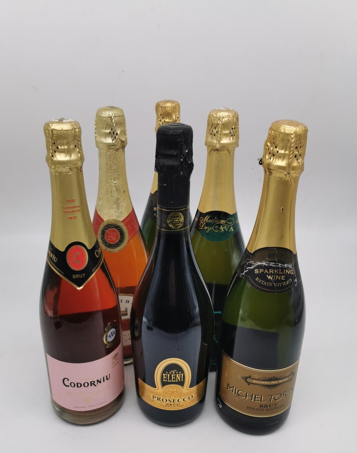 Six bottles of sparkling wine: Santa Eleni Prosecco Brut, two Michel Toring Brut, Sevisa Cava,