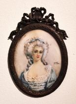 A brass framed and glazed 19th century portrait miniature of a lady in a blue silk dress with
