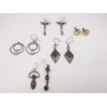 A collection of gemstone earrings, including a pair of early 20th century carved Citrine 9ct rose