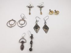 A collection of gemstone earrings, including a pair of early 20th century carved Citrine 9ct rose