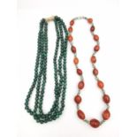 Two gemstone necklaces, including a three strand malachite bead necklace with white and yellow 14