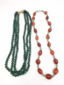 Two gemstone necklaces, including a three strand malachite bead necklace with white and yellow 14