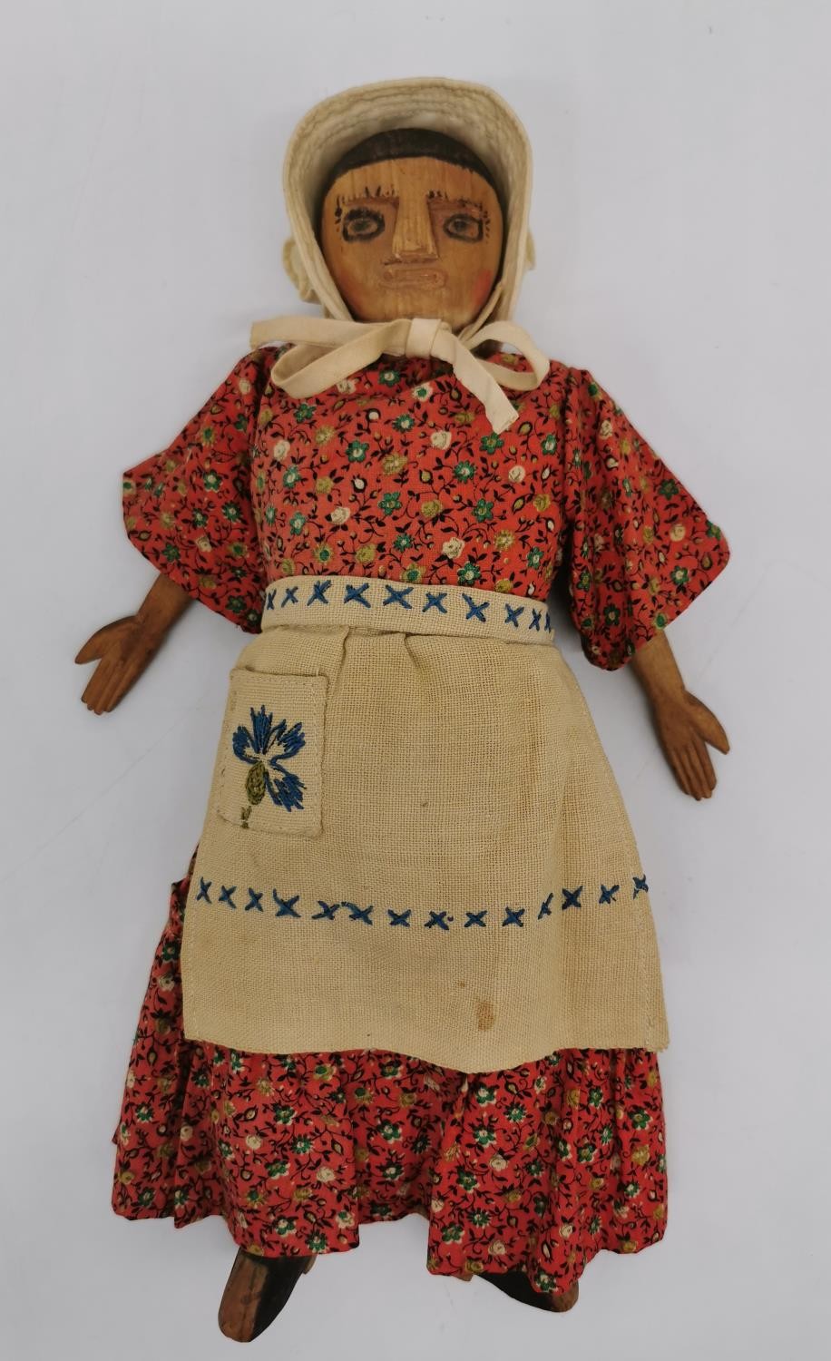 An early 20th century carved wood and cloth child's folk doll with drawn on features. L.32cm (arms - Image 2 of 7