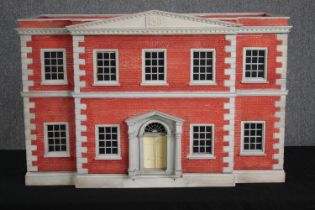 A vintage Tiger Toys Queen Anne dolls house. Scale 1inch=12inch. Has four large rooms, lower