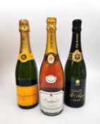 Three boxed bottles of Champagne Pol Roger 2000, Veuve Clicquot Ponsardin Brut and Oudinot Rose