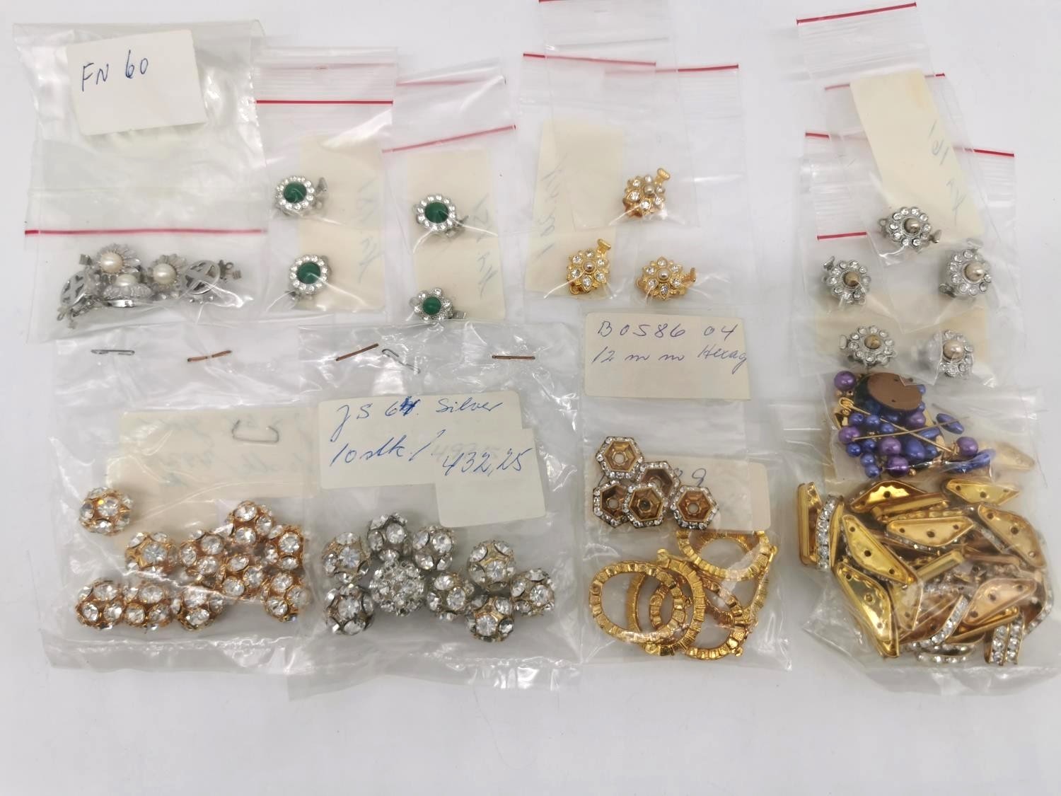 A collection of folk costume fittings, including clasps, spacers, beads and other craft items. - Image 5 of 5