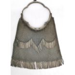 An Alpaca chain mail ladies evening bag with metal fringing and tassel detailing to the sides.