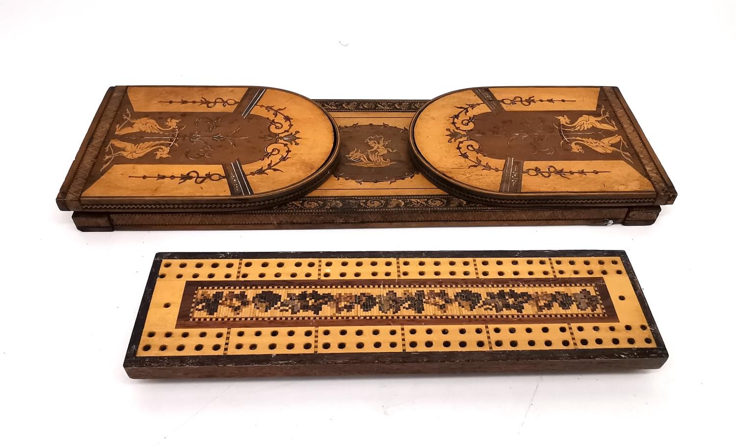 An early 20th century marquetry folding book slide and cribbage board. The book slide with classical