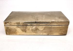 A silver cedar lined cigarette box by Goldsmiths and Silversmiths, Regent Street. Hallmarked: