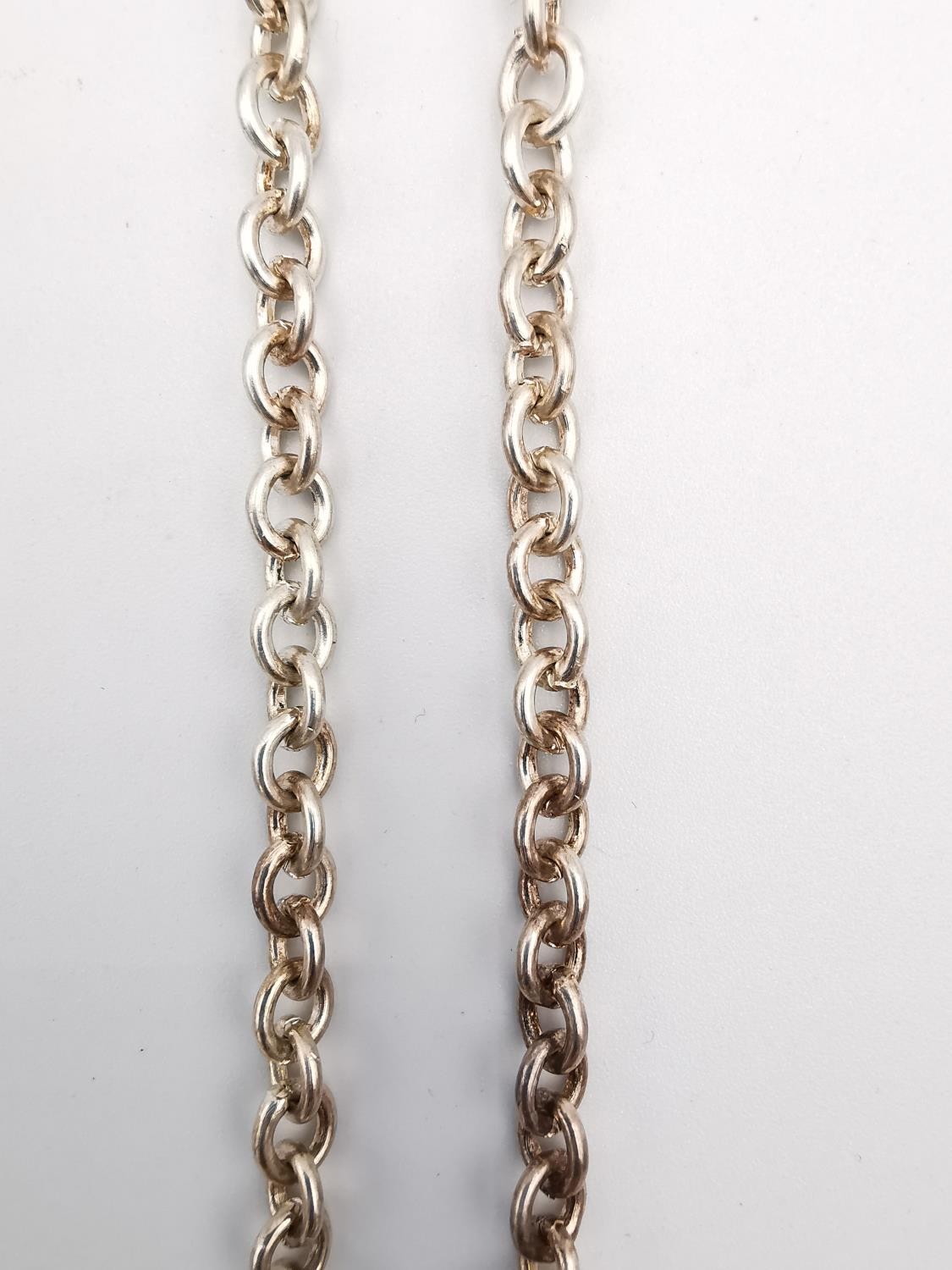 A white metal (tested as silver) brutalist style cylindrical pendant and oval link chain. - Image 5 of 5