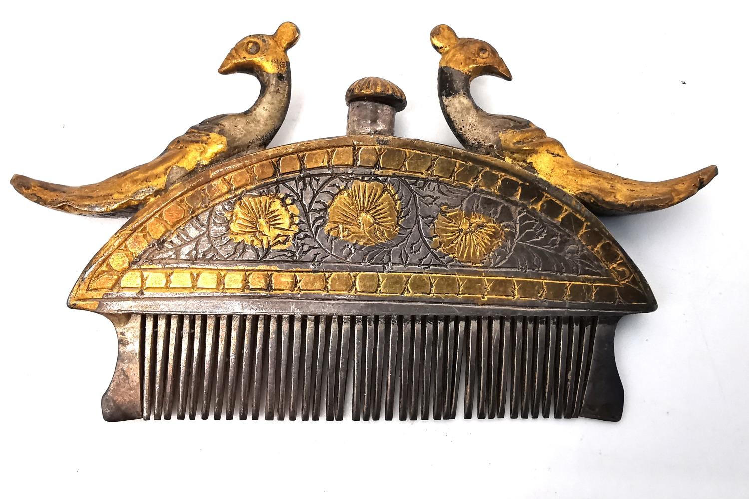 A 19th century Indian white metal and gilt moustache and beard comb of crescent form with a cast - Image 2 of 4