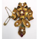A 19th century yellow metal (tests as gold) sculptural floral design articulated brooch, set with