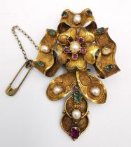 A 19th century yellow metal (tests as gold) sculptural floral design articulated brooch, set with