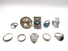 A collection of ten antique and vintage rings, including four silver rings, a brass and foil