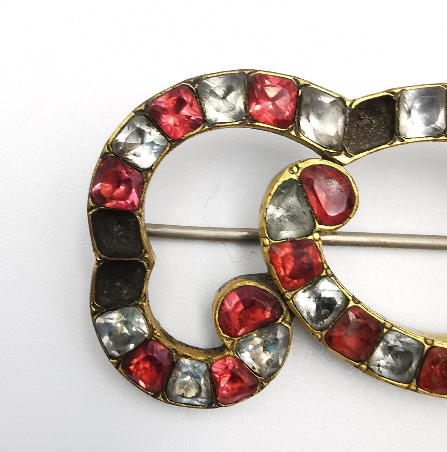 A collection of antique brooches, including a foil backed paste set red and white stone scrolling - Image 5 of 11