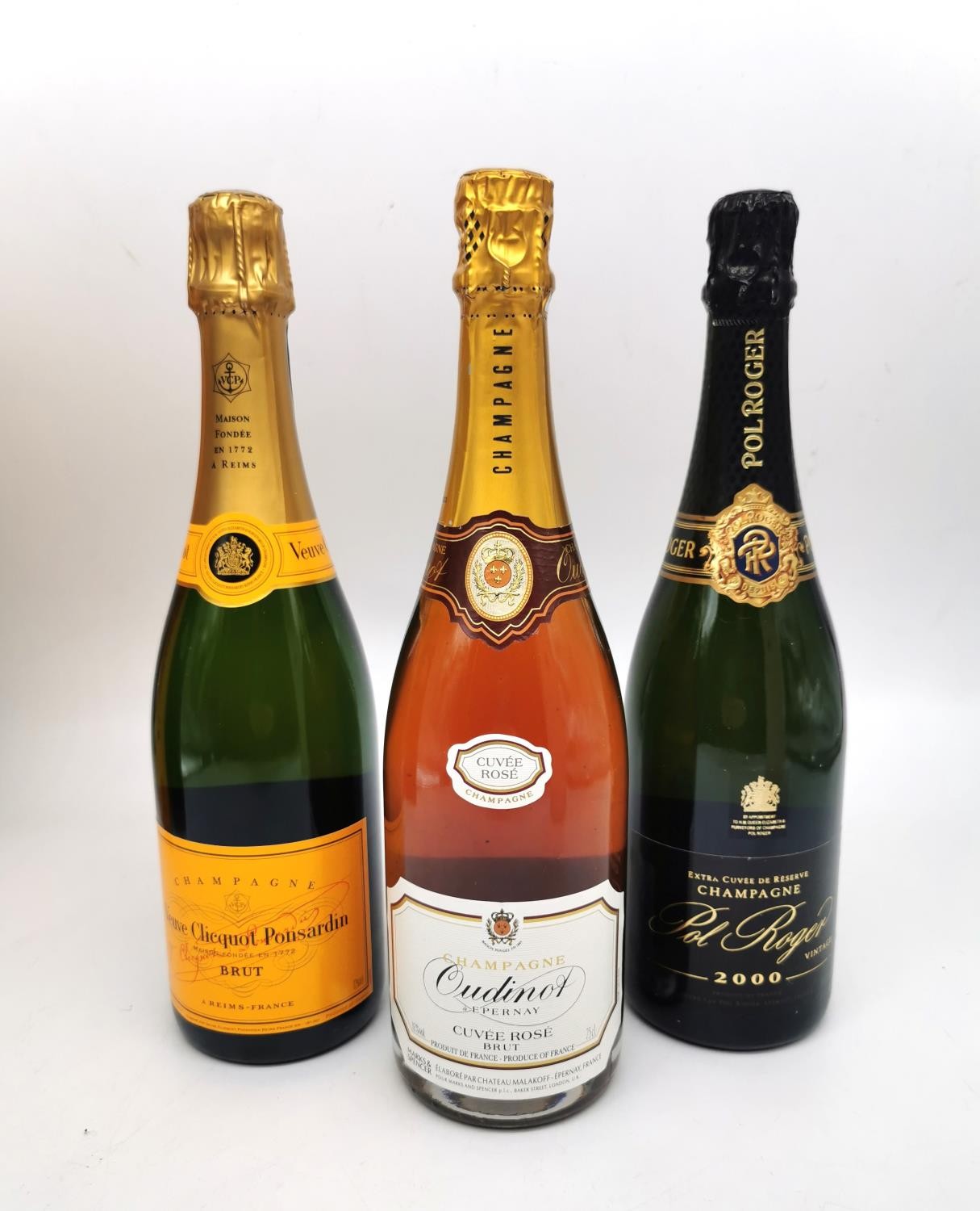Three boxed bottles of Champagne Pol Roger 2000, Veuve Clicquot Ponsardin Brut and Oudinot Rose