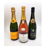 Three boxed bottles of Champagne Pol Roger 2000, Veuve Clicquot Ponsardin Brut and Oudinot Rose