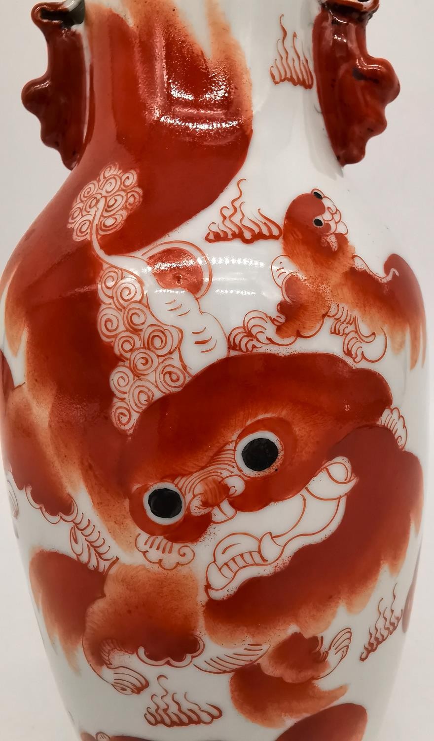 A Chinese iron red 'Buddhist lion vase. Decorated with two fu lion form handles and the body hand - Image 4 of 12