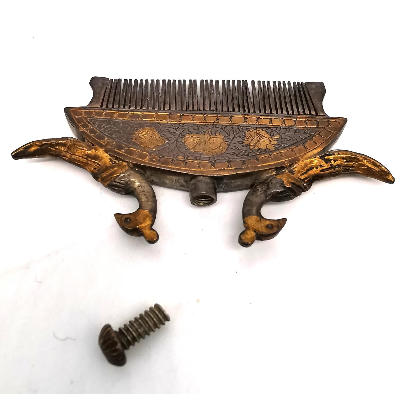 A 19th century Indian white metal and gilt moustache and beard comb of crescent form with a cast - Image 4 of 4