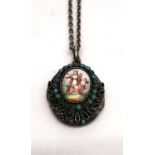 A 19th century white metal locket and metal chain. The front of the locket with an enamel plaque