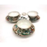 A collection of four Famille rose style egg shell porcelain hand painted tea bowls and three