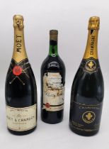 Two magnums of Champagne and a 1974-Saint-Émilion, Château Le Jurat Grand Cru. The bottles of