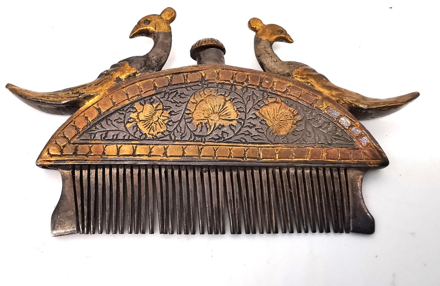 A 19th century Indian white metal and gilt moustache and beard comb of crescent form with a cast - Image 3 of 4