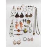 A collection of silver and white metal jewellery, including a ammonite suite of earrings and a