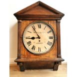 An early 20th century mahogany architectural design wall clock, the circular painted dial signed