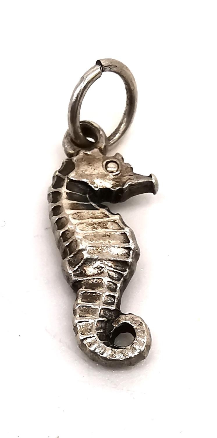 A collection of five Georg Jensen silver charms: a seahorse, an elephant, a carp, a pelican and a - Image 3 of 9