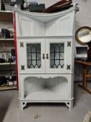A late 19th century painted Arts and Crafts corner cabinet. H.175 W.100 D.60cm.