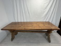 Farmhouse table, 19th century pine on X stretchered trestle supports. (Missing its stretcher