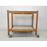 A vintage beech and composite laminated drinks or tea trolley. H.70 W.75 D.46cm.
