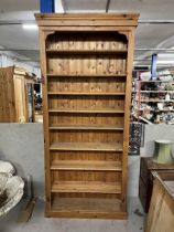 Open bookcase, full height 19th century style pine. H.268 W.109 D.34cm.