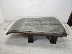 A large coffee table with plate glass top, reclaimed from an antique sleigh. H.46 W.170 D.115cm.