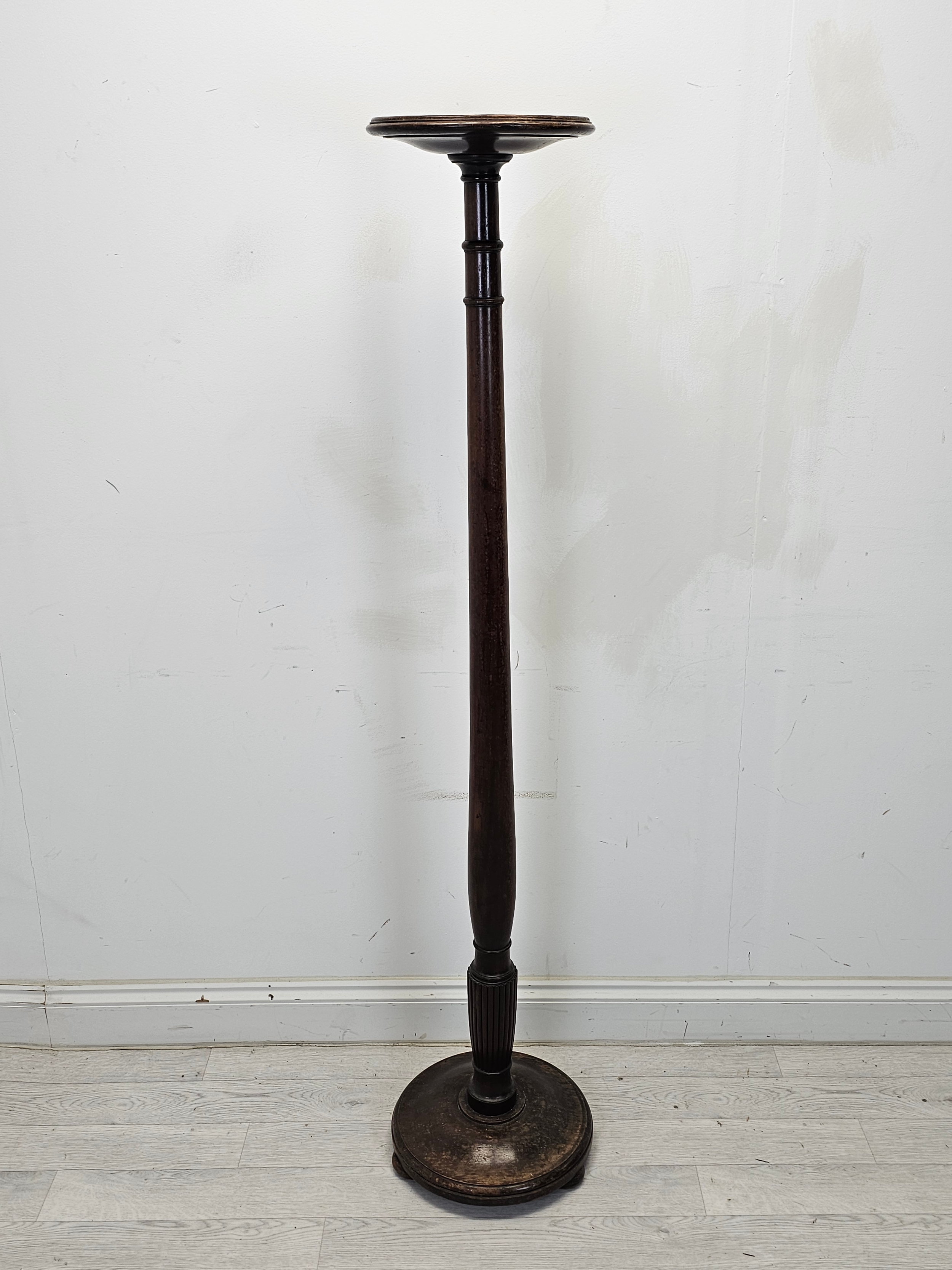 A C.1900 mahogany torchère. H.153cm.